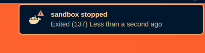 A desktop notification: sandbox stopped, Exited (137)